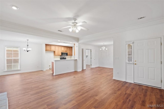 unfurnished living room with baseboards, visible vents, crown molding, light wood-type flooring, and ceiling fan with notable chandelier