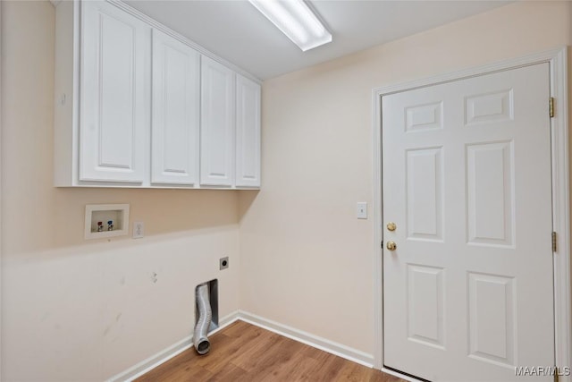 laundry area featuring hookup for an electric dryer, washer hookup, wood finished floors, baseboards, and cabinet space