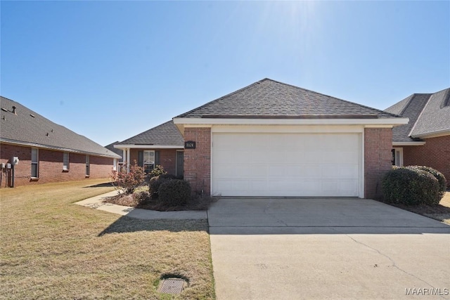 single story home with brick siding, roof with shingles, concrete driveway, a front yard, and a garage