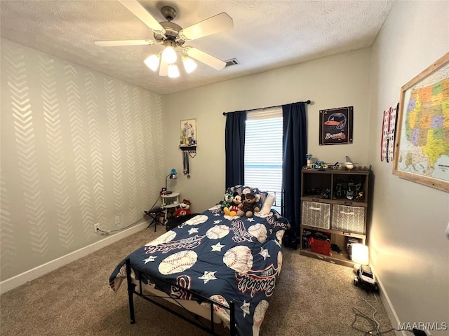 bedroom with a textured ceiling, carpet, visible vents, and baseboards