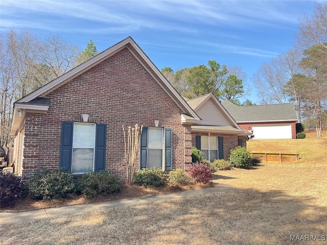 view of front of home featuring brick siding