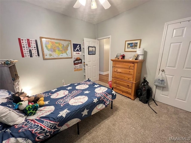 bedroom with a ceiling fan and carpet flooring