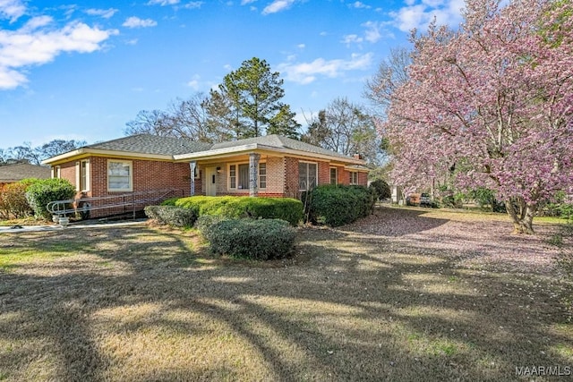 view of side of property with brick siding