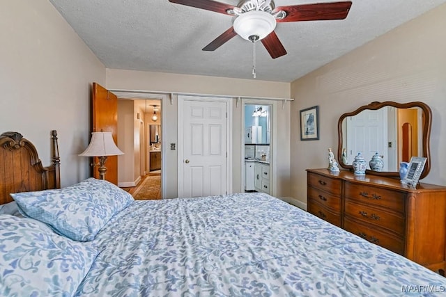bedroom featuring baseboards, a ceiling fan, and a textured ceiling