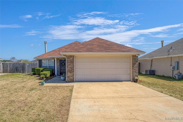 ranch-style house featuring an attached garage, central AC, fence, driveway, and a front lawn