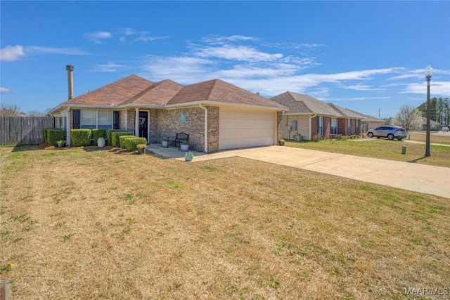 ranch-style home with brick siding, a front yard, fence, a garage, and driveway