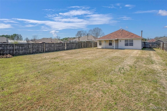 view of yard featuring a fenced backyard