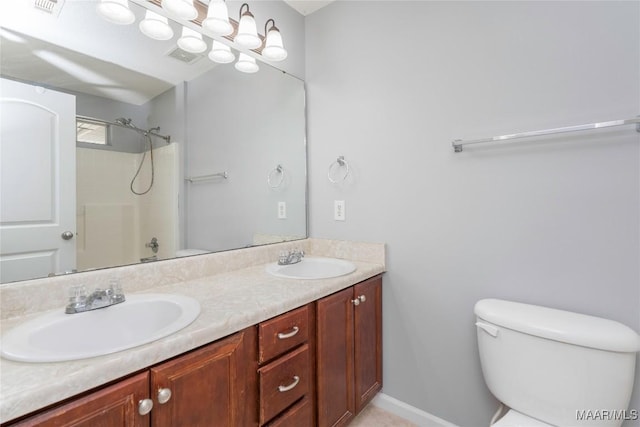 full bath featuring a shower, a sink, toilet, and double vanity