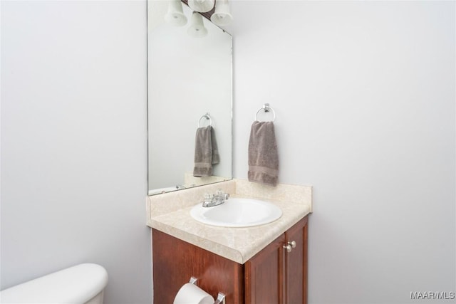 bathroom with vanity and toilet