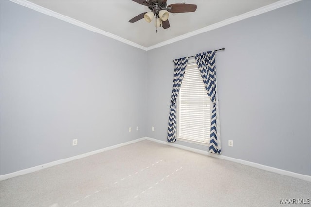 unfurnished room featuring carpet, baseboards, ceiling fan, and crown molding