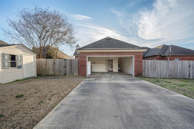 exterior space with fence, concrete driveway, and brick siding