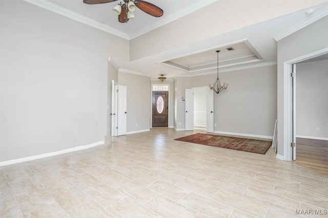 foyer featuring a tray ceiling, crown molding, visible vents, baseboards, and ceiling fan with notable chandelier