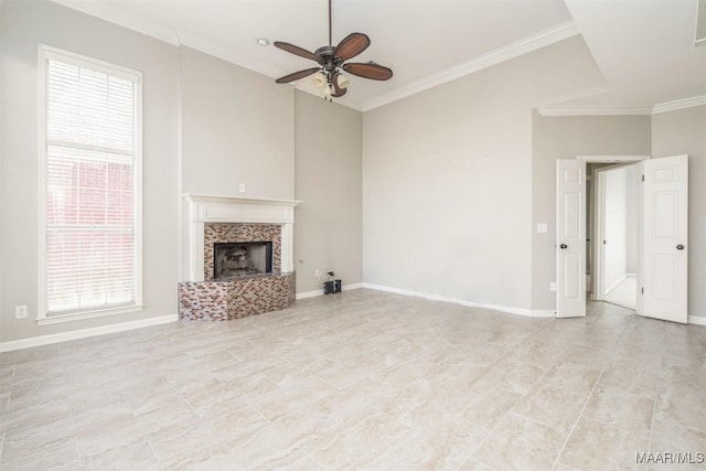 unfurnished living room featuring ornamental molding, a fireplace, and baseboards