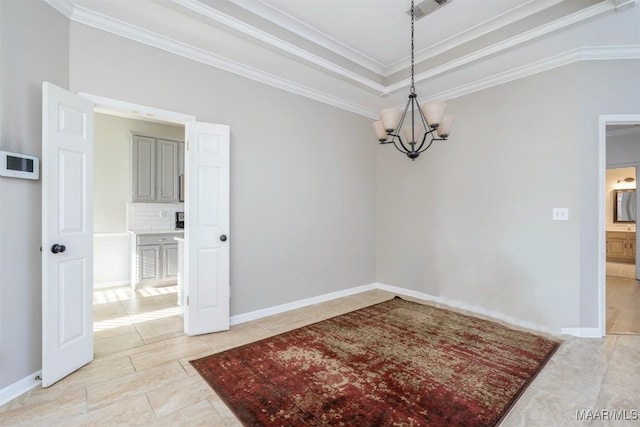 dining room featuring a chandelier, a raised ceiling, visible vents, and ornamental molding