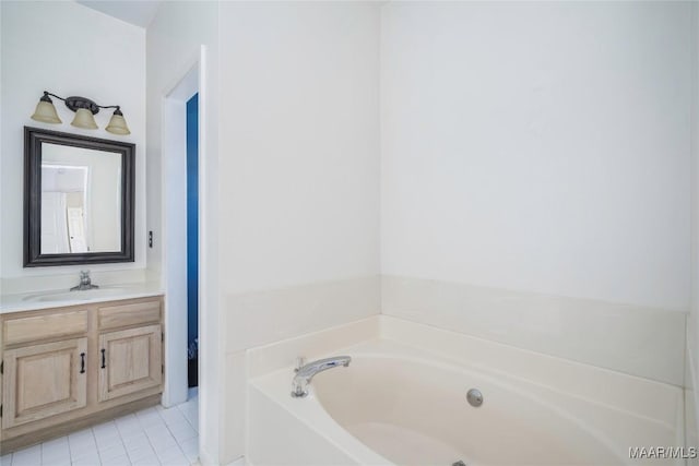 full bath with tile patterned floors, a bath, and vanity