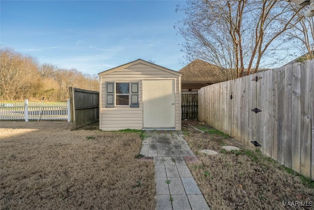 view of shed featuring a fenced backyard