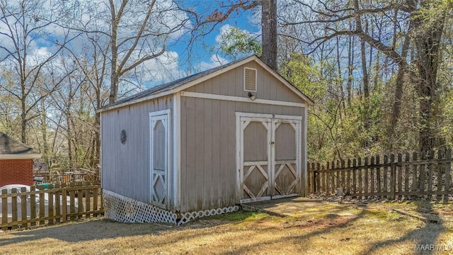 view of shed with fence