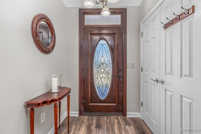 entryway featuring baseboards and dark wood-style flooring