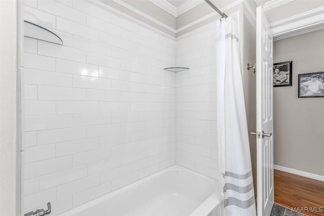 full bath featuring shower / tub combo with curtain, baseboards, crown molding, and wood finished floors