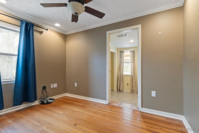 5180 Grace St, Millbrook, AL 36054 - unfurnished room featuring crown molding, a ceiling fan, visible vents, light wood finished floors, and baseboards