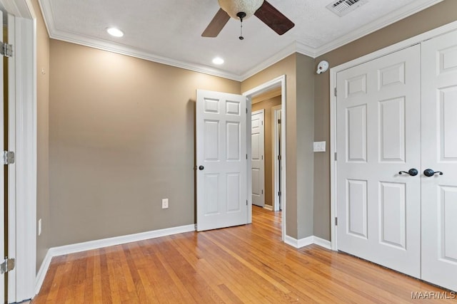 5180 Grace St, Millbrook, AL 36054 - unfurnished bedroom with visible vents, baseboards, ornamental molding, light wood-type flooring, and recessed lighting