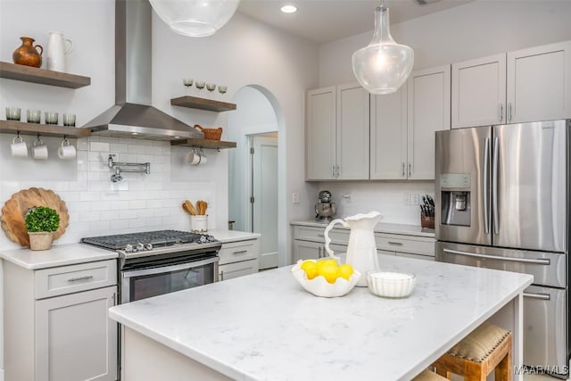 7808 Ebury St, Montgomery, AL 36116 - kitchen with appliances with stainless steel finishes, light stone countertops, wall chimney exhaust hood, and open shelves