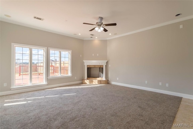 unfurnished living room featuring crown molding, visible vents, a fireplace, and baseboards