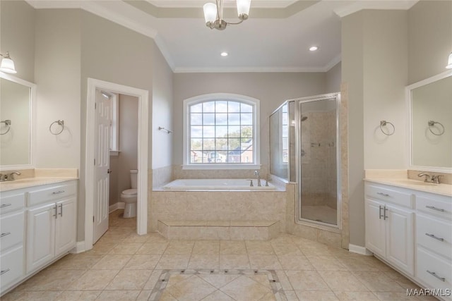 bathroom featuring toilet, a sink, ornamental molding, a bath, and a stall shower