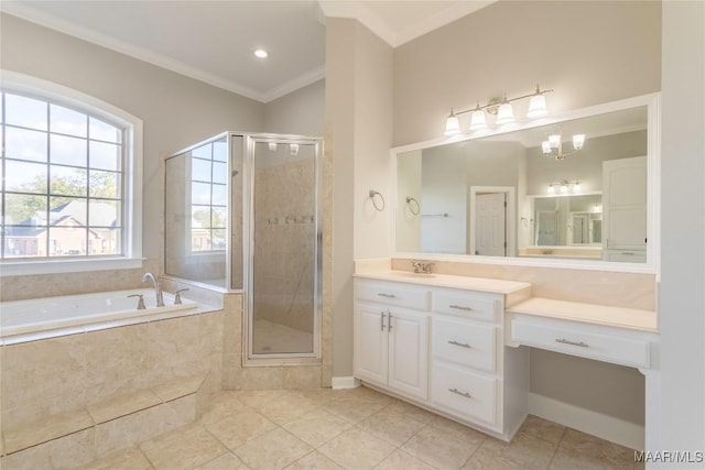 bathroom with a stall shower, ornamental molding, a garden tub, and vanity