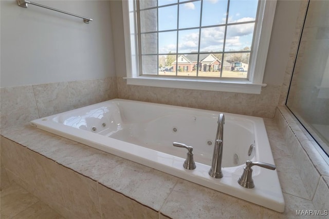 full bath featuring a whirlpool tub