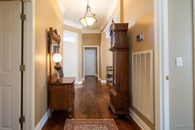 corridor with a heating unit, baseboards, dark wood-type flooring, and crown molding