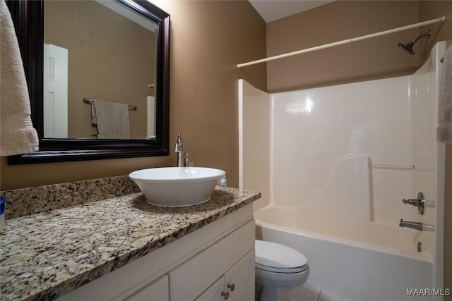 full bath featuring toilet,  shower combination, tile patterned flooring, and vanity