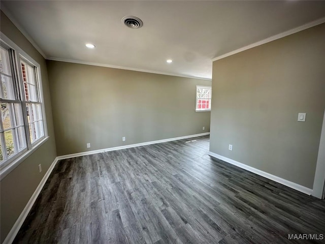 unfurnished room featuring dark wood-style flooring, crown molding, recessed lighting, visible vents, and baseboards