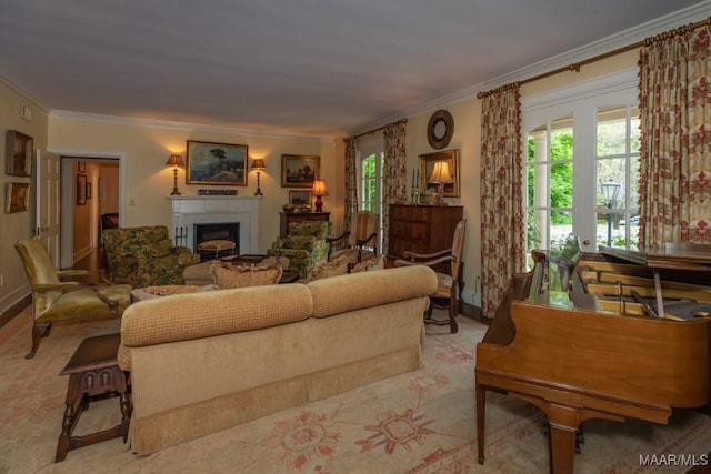 living area featuring crown molding, a fireplace, and baseboards