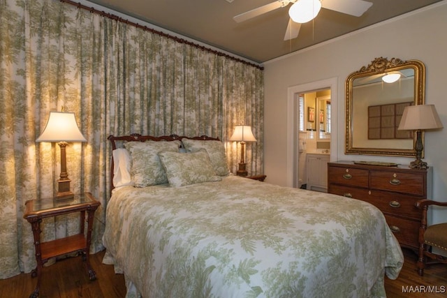 bedroom featuring ornamental molding, ceiling fan, ensuite bathroom, and wood finished floors