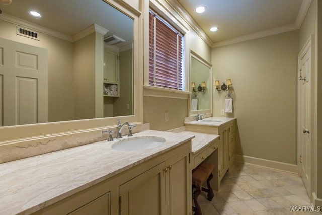 bathroom with ornamental molding, two vanities, a sink, and visible vents