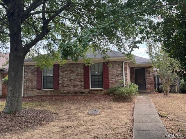 single story home with brick siding