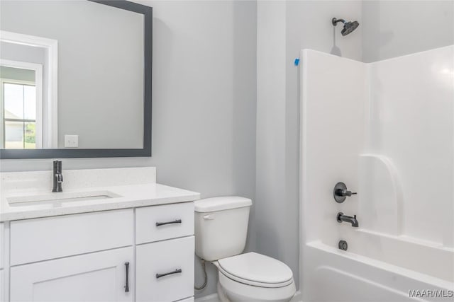 bathroom featuring toilet, shower / tub combination, and vanity