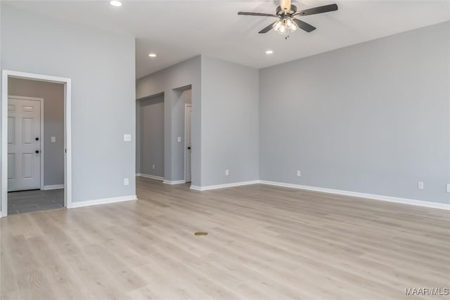 unfurnished room featuring light wood-style flooring, baseboards, a ceiling fan, and recessed lighting