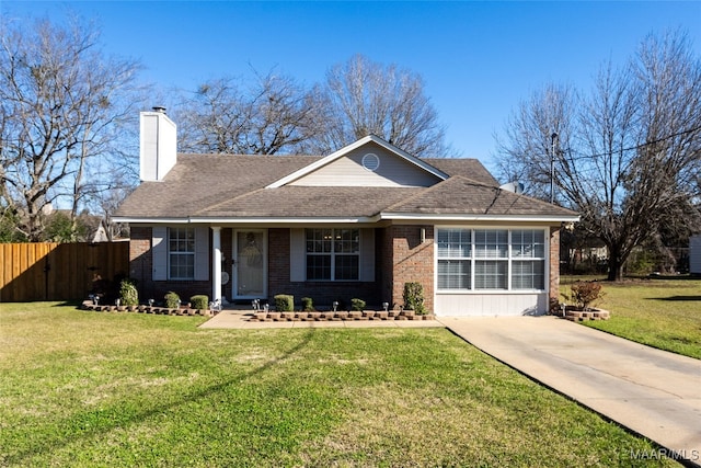 ranch-style house featuring brick siding, a front lawn, a chimney, and fence