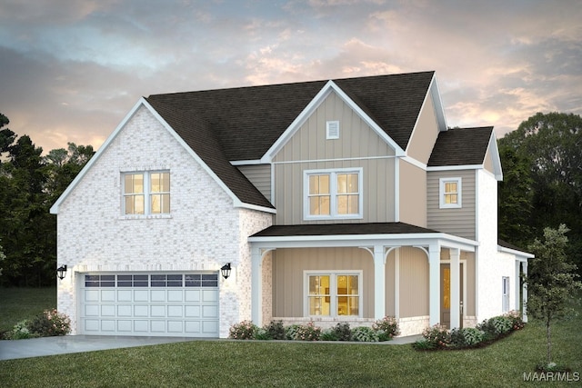 view of front of house with a garage, a shingled roof, concrete driveway, board and batten siding, and a front yard