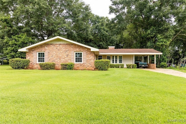 ranch-style home featuring concrete driveway, brick siding, a front yard, and an attached carport