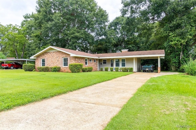 ranch-style home with brick siding, driveway, a front lawn, and an attached carport