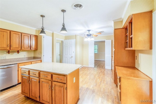 kitchen with light wood-type flooring, light countertops, dishwasher, and visible vents