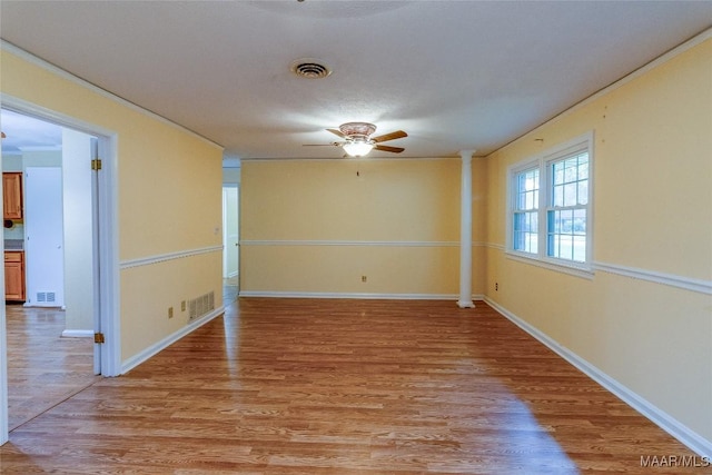 unfurnished room with light wood-style flooring, visible vents, and ceiling fan