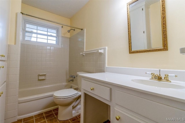 bathroom featuring tile patterned floors, vanity, toilet, and shower / bathtub combination