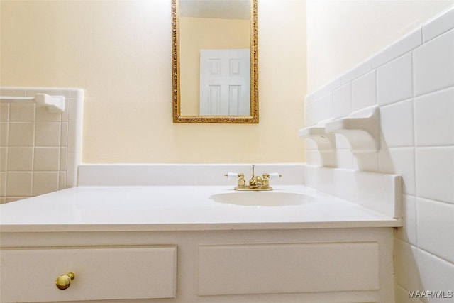 bathroom with tile walls and vanity