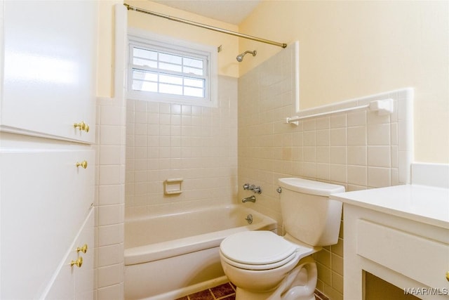 bathroom with  shower combination, tile walls, toilet, and vanity