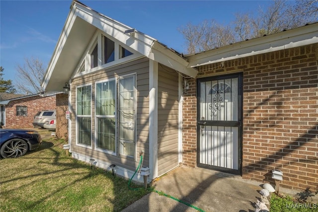 5217 W Shades Valley Dr, Montgomery, AL 36108 - doorway to property with brick siding and a lawn