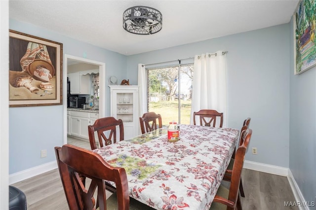 5217 W Shades Valley Dr, Montgomery, AL 36108 - dining space with baseboards and wood finished floors